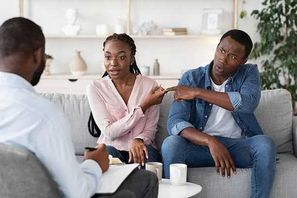 black-couple-blaming-each-other-in-therapist-office
