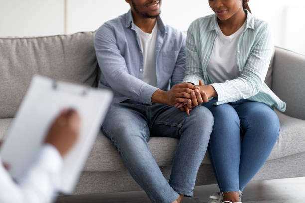 black-couple-sitting-together-in-counselor-office-in-forgiveness-therapy